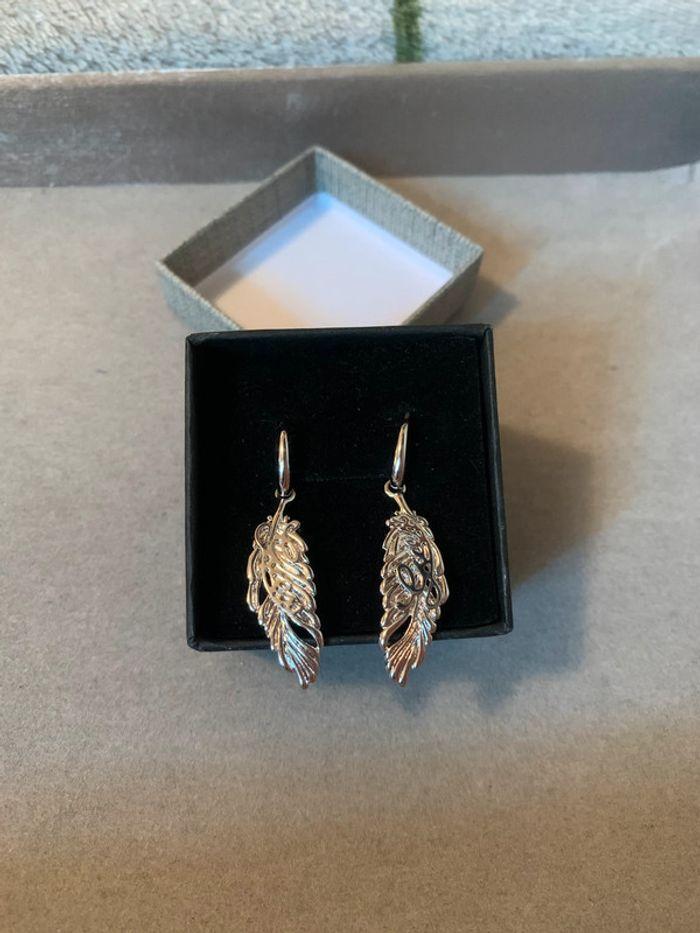 Boucles d'oreilles plumes pendantes en argent - photo numéro 1