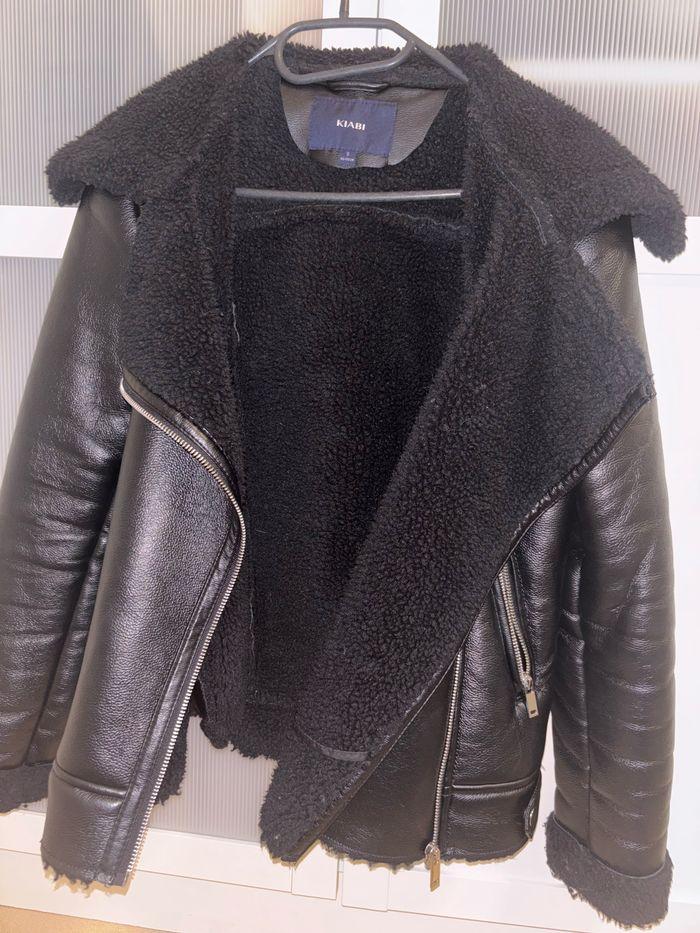 Veste en cuir à fourrure - photo numéro 1