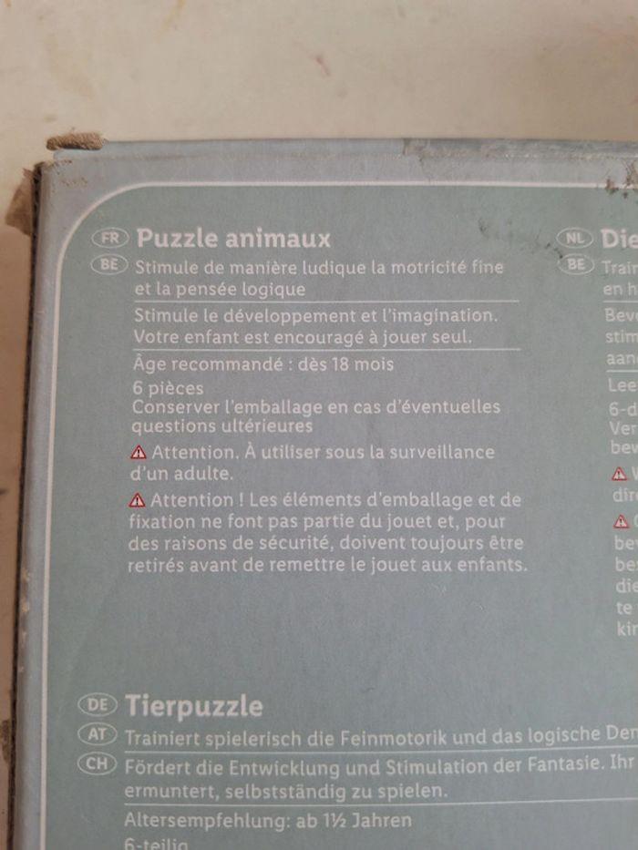 Puzzle animaux en bois en parfait état (emballage en carton abîmé sur un côté) - photo numéro 2