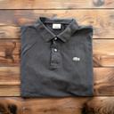 Polo Lacoste noir - Taille 6 (XL) - Excellent état