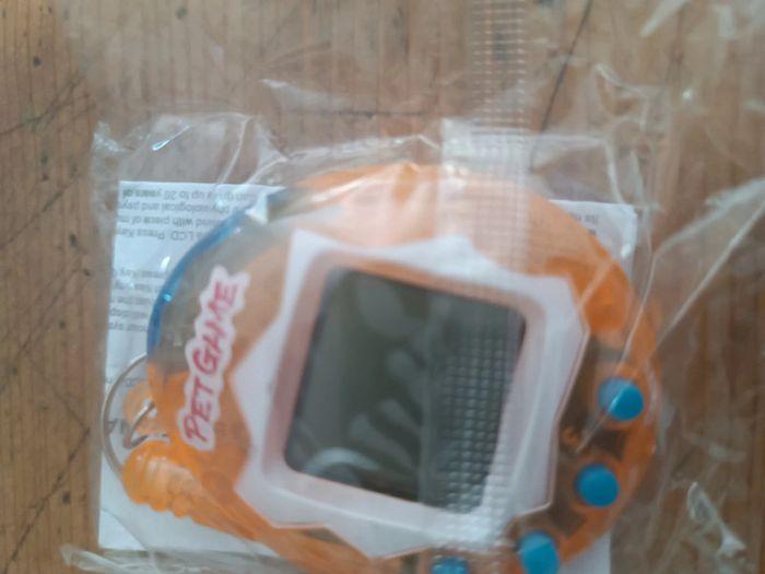 Tamagotchi orange transparent - photo numéro 1