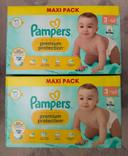 2 paquets de couches Pampers taille 3