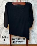 Pull noir tombé en pointe devant Encolure et base asymétrique. Marque Duger