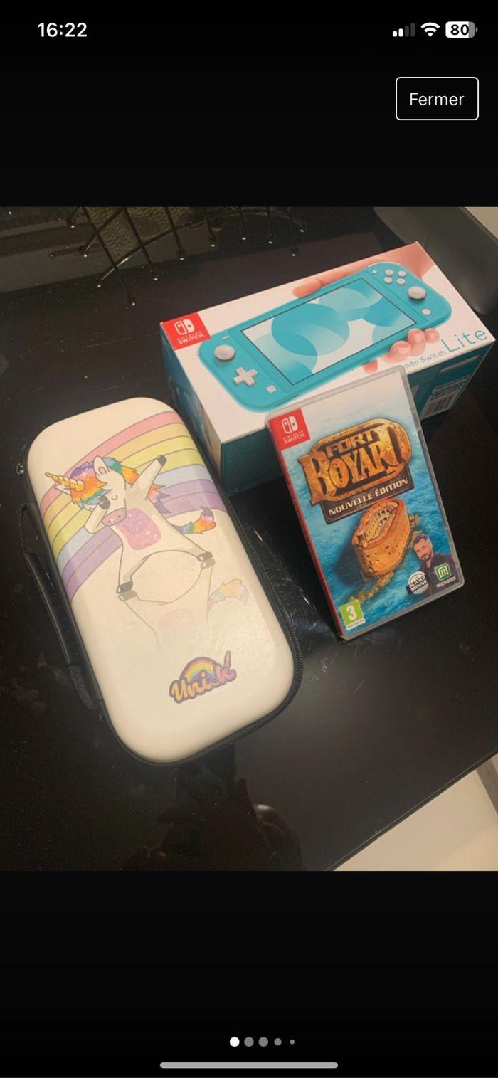 Switch lite original+jeux+rangement - photo numéro 1