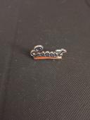 Pin's logo Ford Escort signé SCM