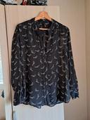 Blouse noire à motif revolver Mango