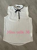 Blouse débardeur blanc et noir sans manche volant épaule et noeud devant mim taille 36