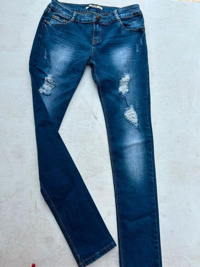 Jean skinny taille basse bleu à trous - photo numéro 1