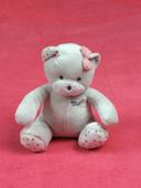 Doudou peluche ours gris blanc fille Musti nœud rose pieds étoile Mustela