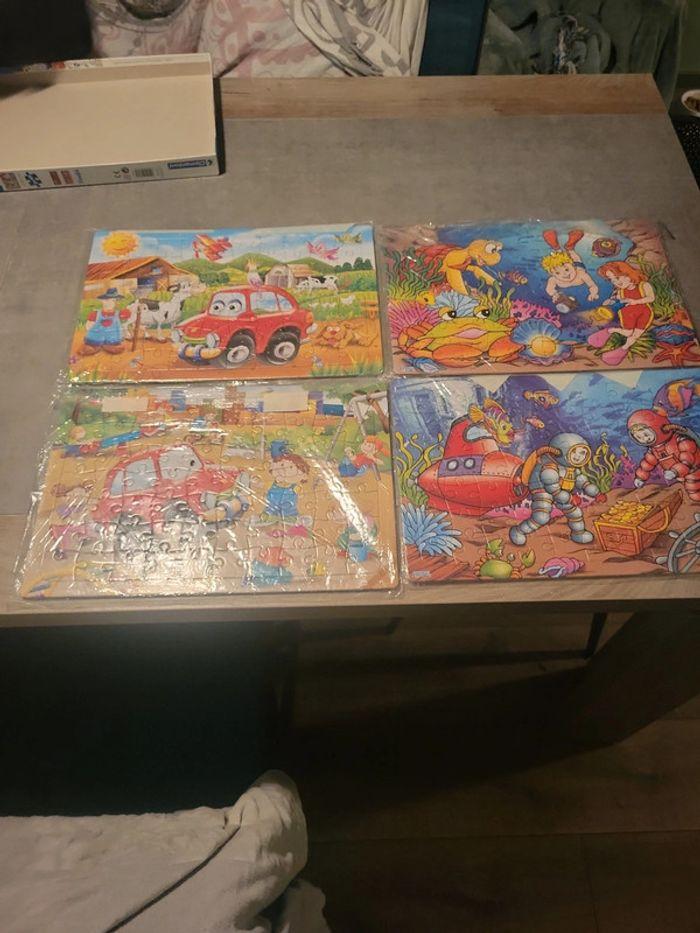 Lot de 4 puzzles - photo numéro 1