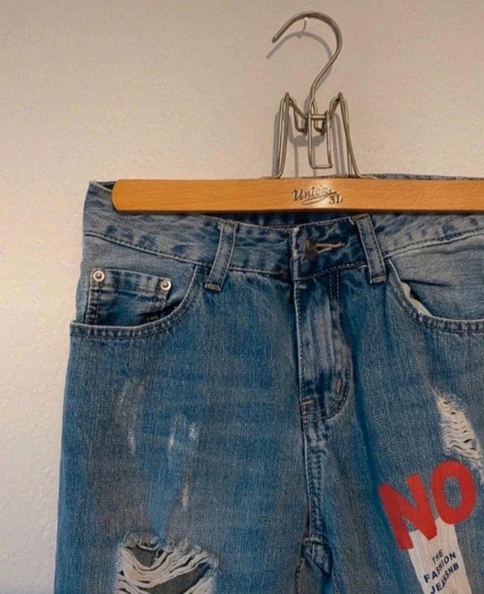 Jeans troués - photo numéro 1