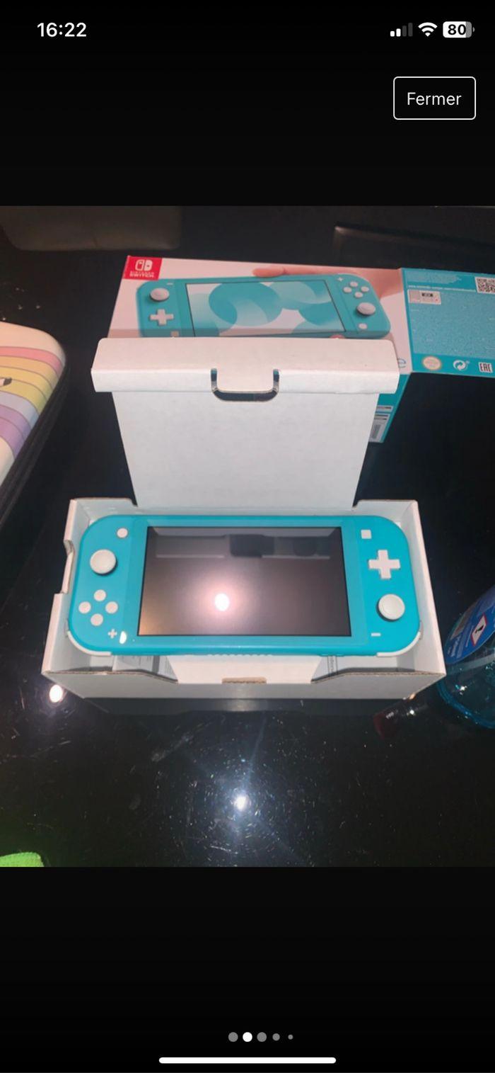 Switch lite original+jeux+rangement - photo numéro 2