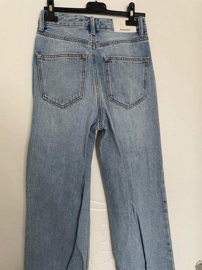 Jean bleu clair taille haute coupe straight flare jambe large effet déchiré stradivarius taille 32 - photo numéro 4