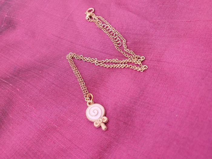 Collier avec le pendentif sucette rose doré