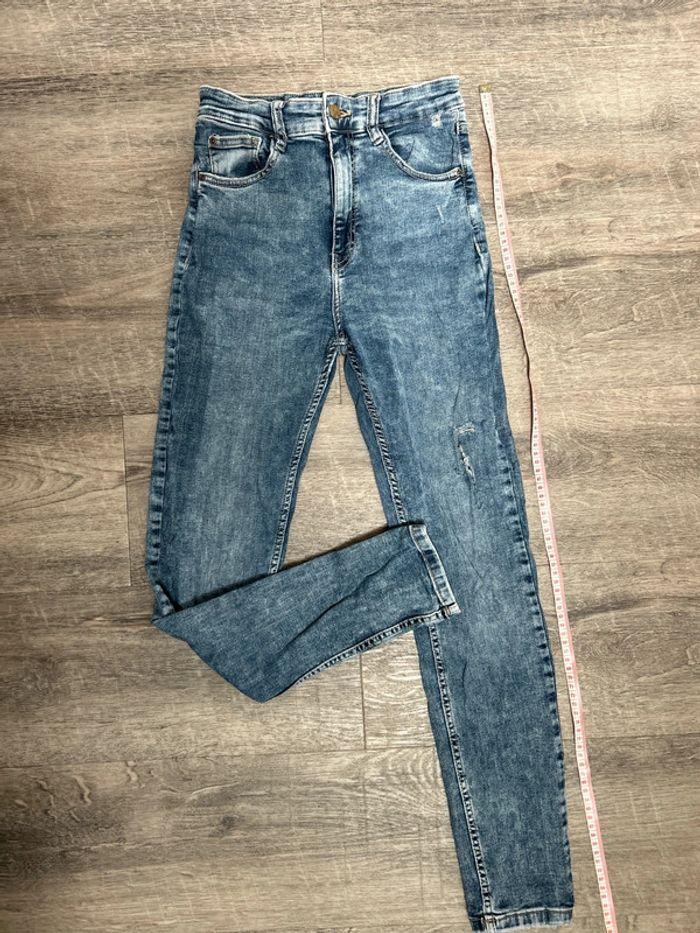 Jeans taille haute effet délavé troué - photo numéro 1