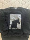 Pull noir argenté 8/9 ans