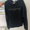 Pull Tommy finger véritable couleur noir, taille 8 ans