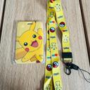 Porte carte Pokémon pickachu jaune tour de cou lanière