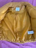 Blouson femme jaune moutarde tire sur du doré