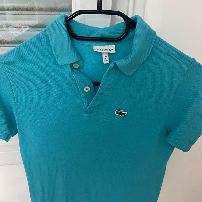 Polo Lacoste bleu turquoise, taille 10 ans en très bon état - photo numéro 2