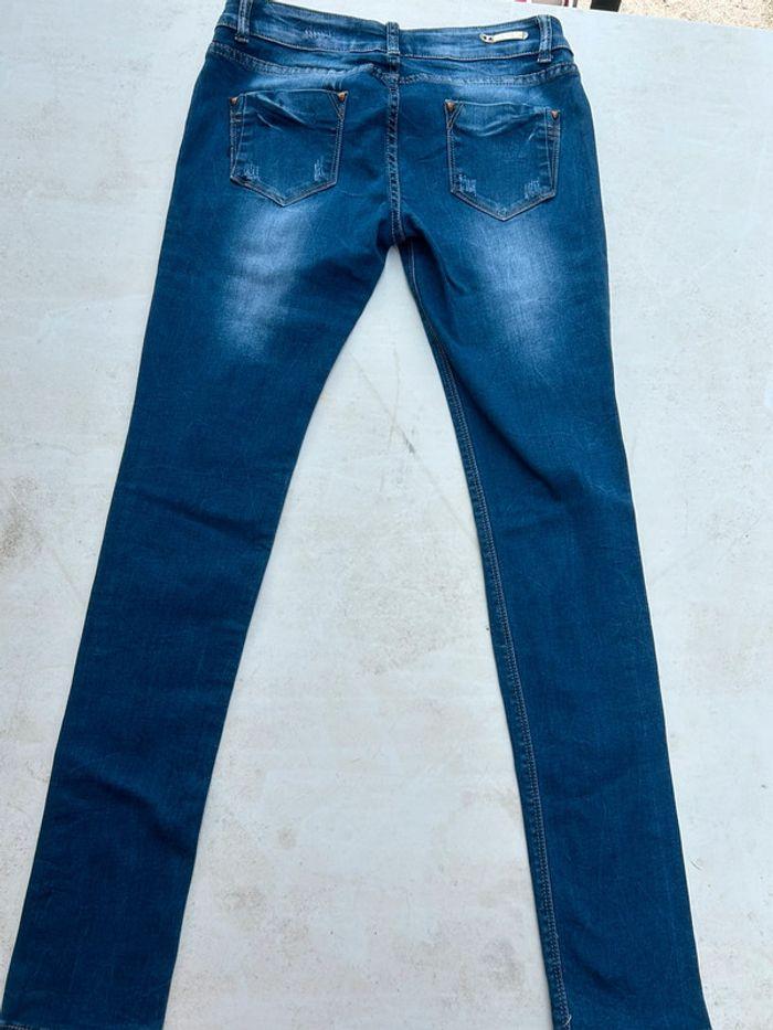 Jean skinny taille basse bleu à trous - photo numéro 4