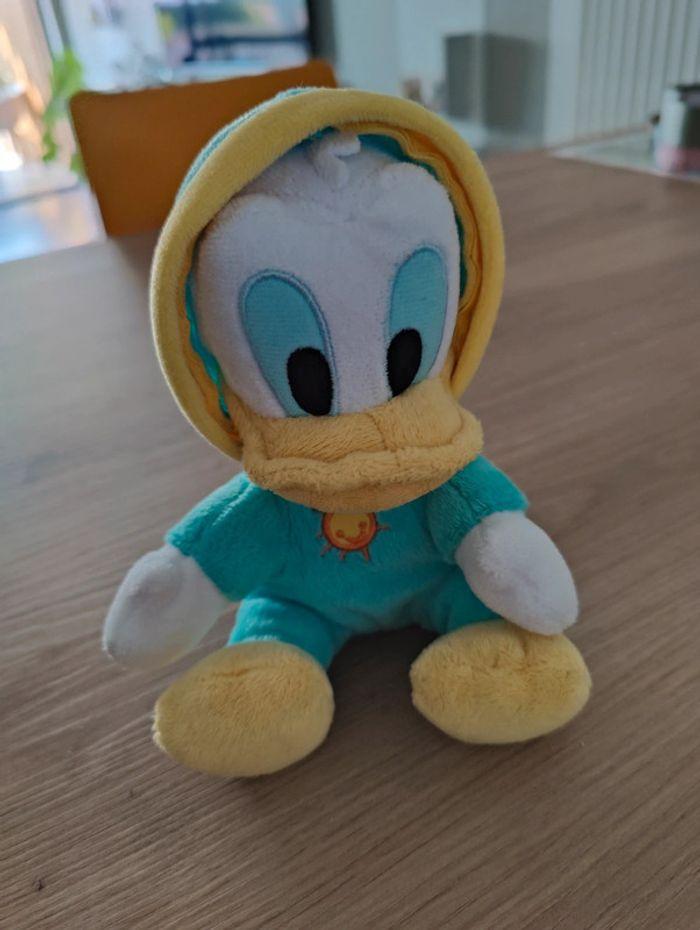 Peluche Donald en grenouillère bleue - photo numéro 1