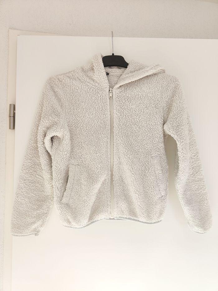 Veste blanche crème peluche Kiabi 10ans - photo numéro 1