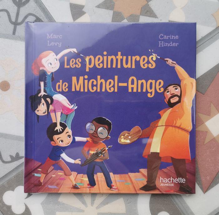 Livre LES PEINTURES DE MICHEL ANGE de MARC LEVY et CARINE HINDER HACHETTE JEUNESSE neuf