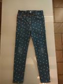 Pantalon fille bleu avec des motifs fleurs 9-10 ans