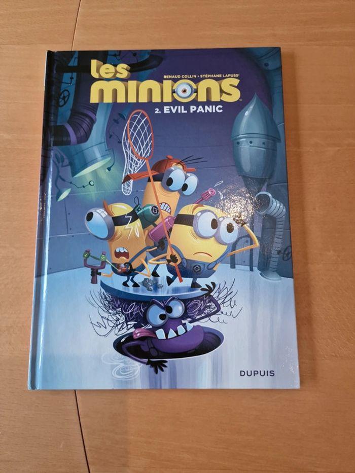 Livre les Minions - tome 2 evil panic en TBE 
Éditions Dupuis - photo numéro 1