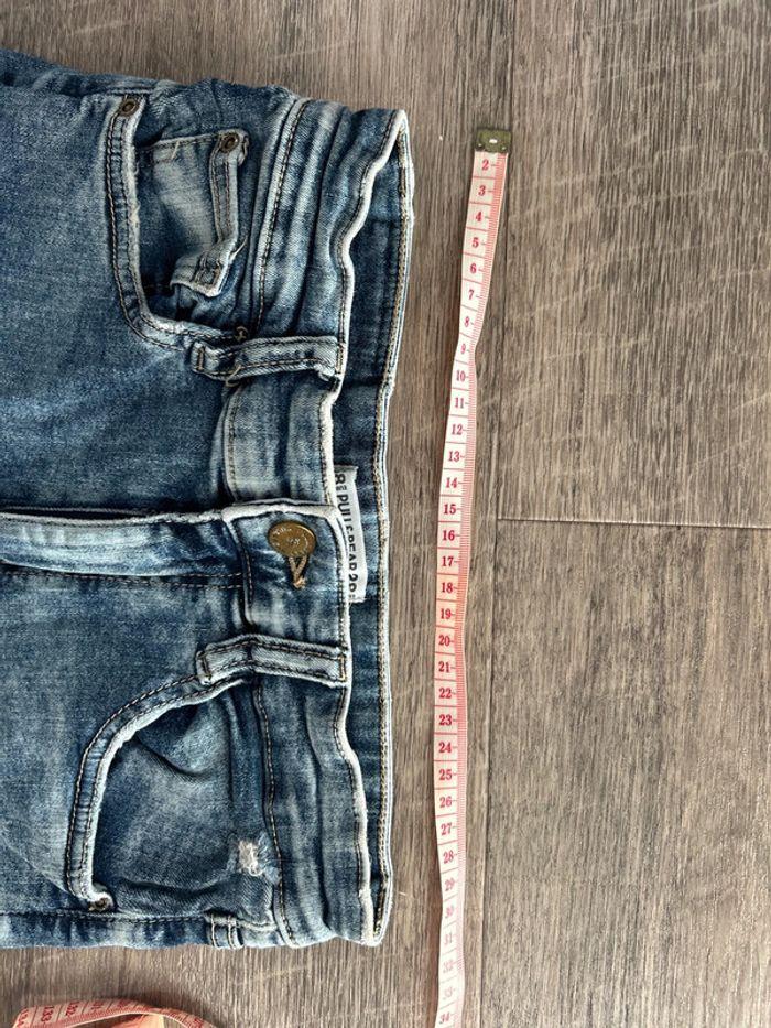 Jeans taille haute effet délavé troué - photo numéro 4